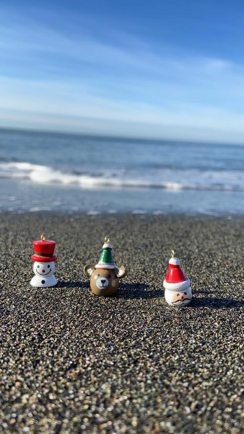 Christmas Ornaments Arranged On A Sunny Beach