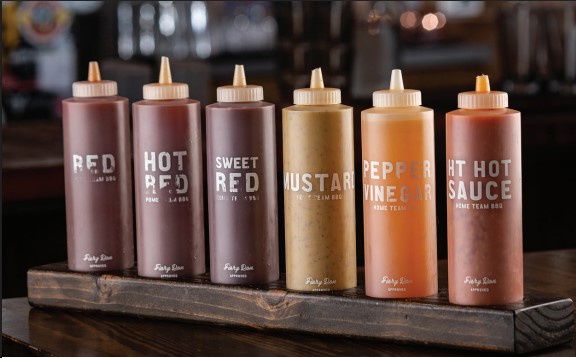 Variety of Southern-style BBQ sauces served at top Charleston SC barbecue restaurants